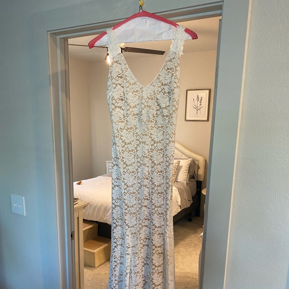 Lulu’s white gown- worn only once and dry cleaned after!